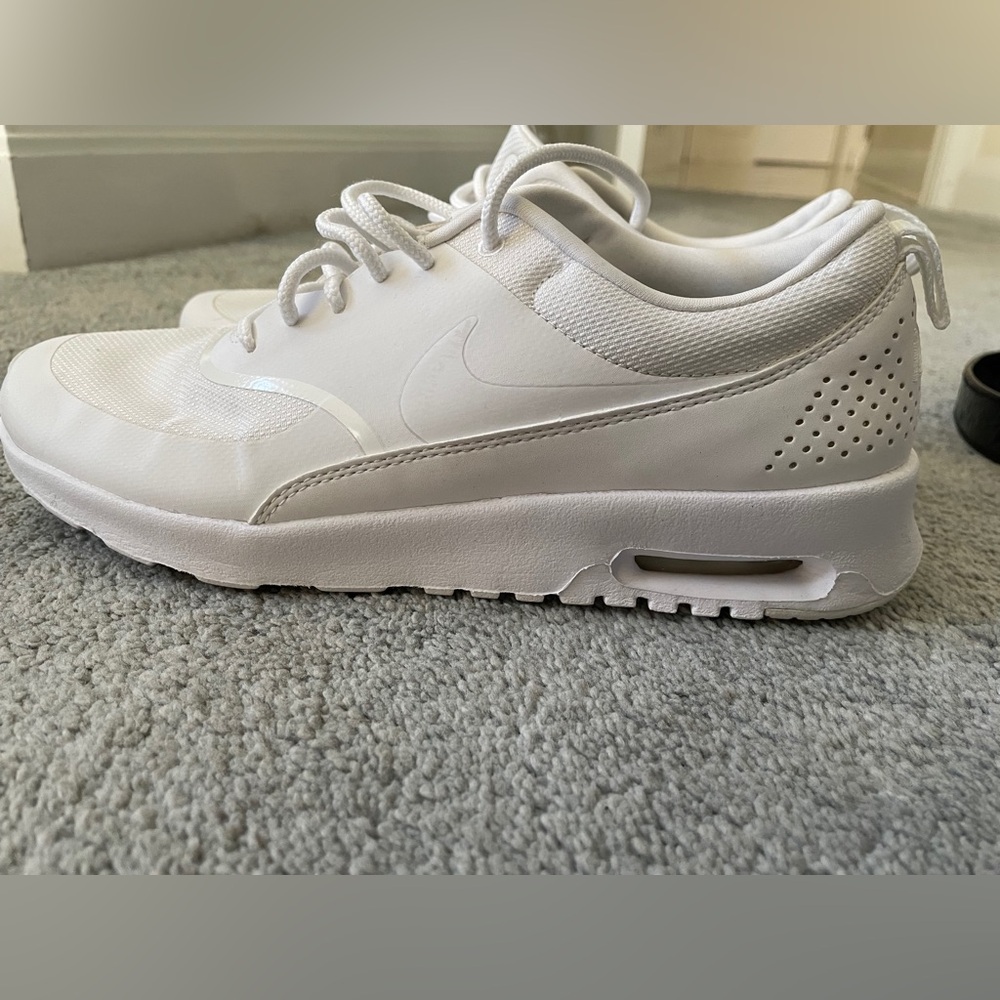 Nike white. Lightweight. Comfortable. Some wear but lots more love to give.